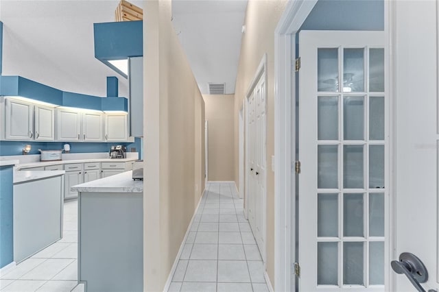 kitchen with light tile patterned floors