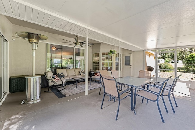 sunroom featuring ceiling fan