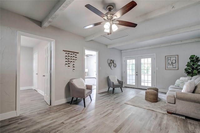 living area with ceiling fan, beamed ceiling, light hardwood / wood-style floors, and french doors