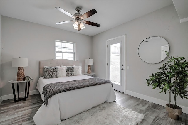 bedroom featuring ceiling fan, access to outside, and wood-type flooring