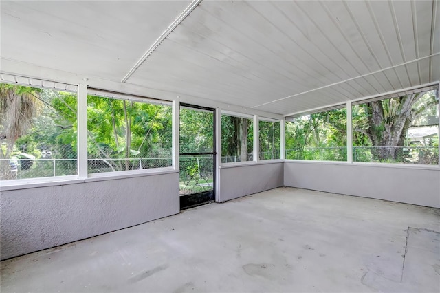 unfurnished sunroom featuring a wealth of natural light