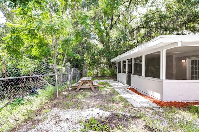 view of yard with a sunroom