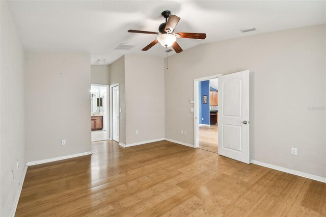 spare room featuring ceiling fan and hardwood / wood-style flooring