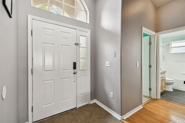 entrance foyer with a wealth of natural light and tile patterned floors