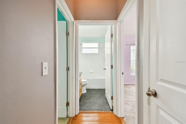 6843 Runner Oak Dr, Wesley Chapel, FL 33545 - corridor with light tile patterned flooring