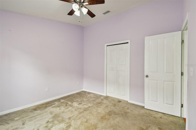6843 Runner Oak Dr, Wesley Chapel, FL 33545 - unfurnished bedroom featuring baseboards, visible vents, ceiling fan, carpet flooring, and a closet