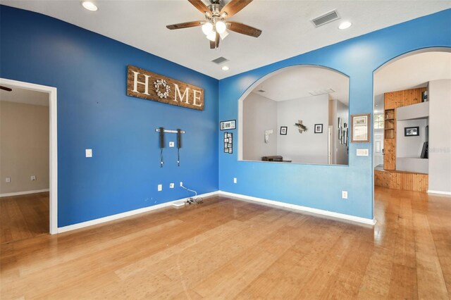 empty room featuring ceiling fan and wood-type flooring