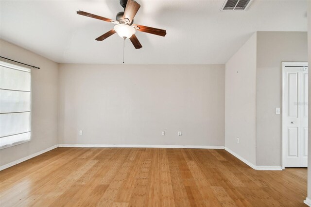 empty room featuring ceiling fan and light hardwood / wood-style floors