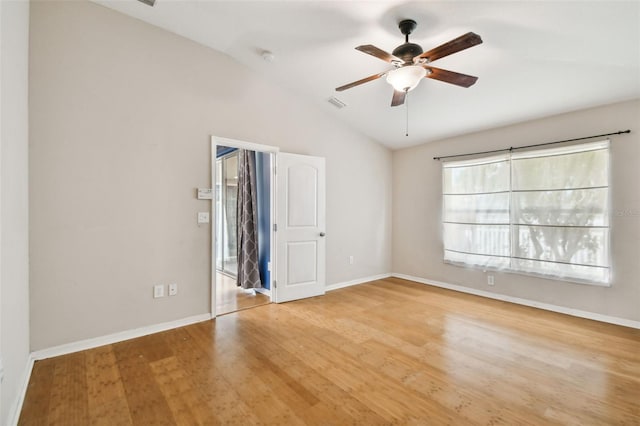 spare room featuring ceiling fan, light hardwood / wood-style floors, and lofted ceiling