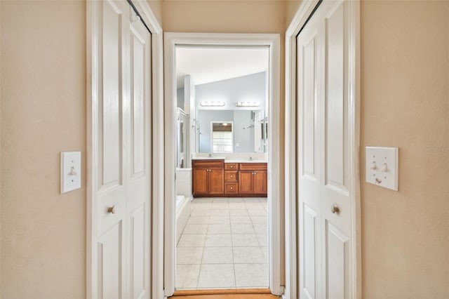 6843 Runner Oak Dr, Wesley Chapel, FL 33545 - corridor featuring light tile patterned floors