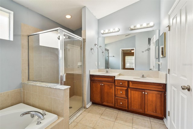 bathroom featuring tile patterned flooring, plus walk in shower, and vanity