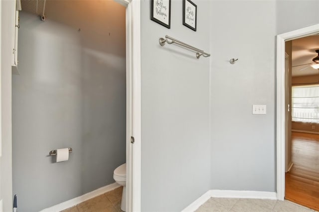 bathroom featuring tile patterned floors, ceiling fan, and toilet