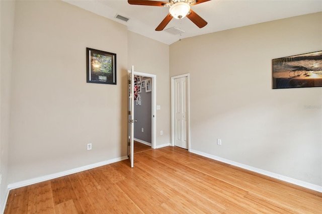 unfurnished bedroom with light wood-type flooring, high vaulted ceiling, and ceiling fan