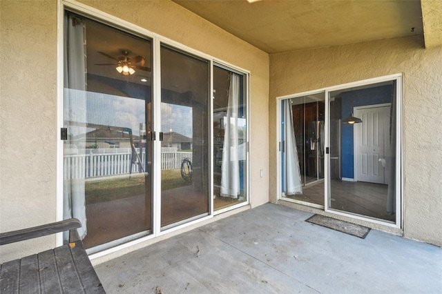 6843 Runner Oak Dr, Wesley Chapel, FL 33545 - doorway to property with a patio area and stucco siding