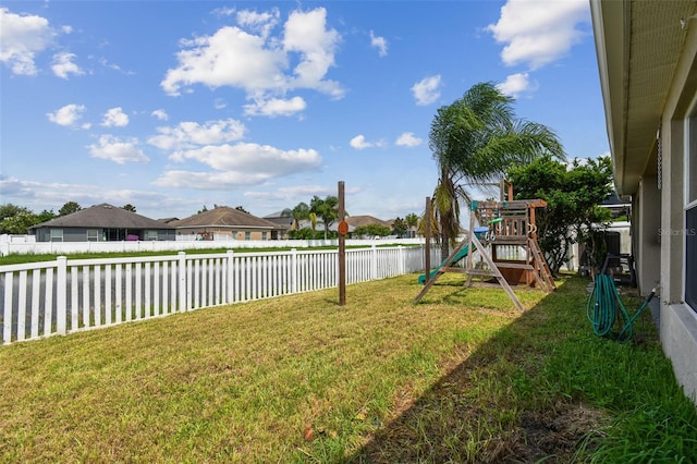 6843 Runner Oak Dr, Wesley Chapel, FL 33545 - view of yard featuring a residential view, a playground, a water view, and a fenced backyard