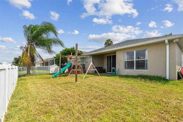 6843 Runner Oak Dr, Wesley Chapel, FL 33545 - view of yard featuring a playground and a fenced backyard