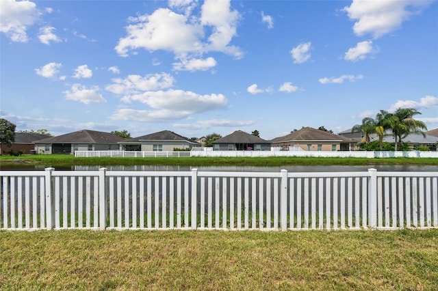6843 Runner Oak Dr, Wesley Chapel, FL 33545 - view of yard with a residential view, a water view, and fence