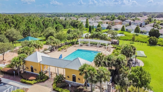 6843 Runner Oak Dr, Wesley Chapel, FL 33545 - pool featuring a patio, fence, a lawn, a residential view, and a pergola