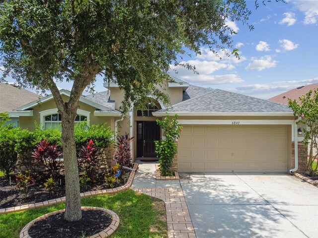 view of front of property with a garage