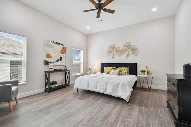 bedroom featuring recessed lighting, wood finished floors, and baseboards