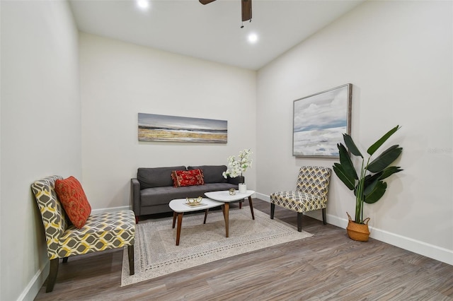 living area featuring a ceiling fan, baseboards, wood finished floors, and recessed lighting