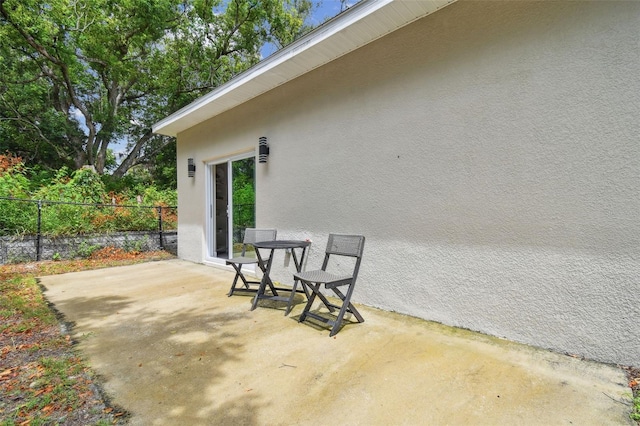 view of patio / terrace featuring fence