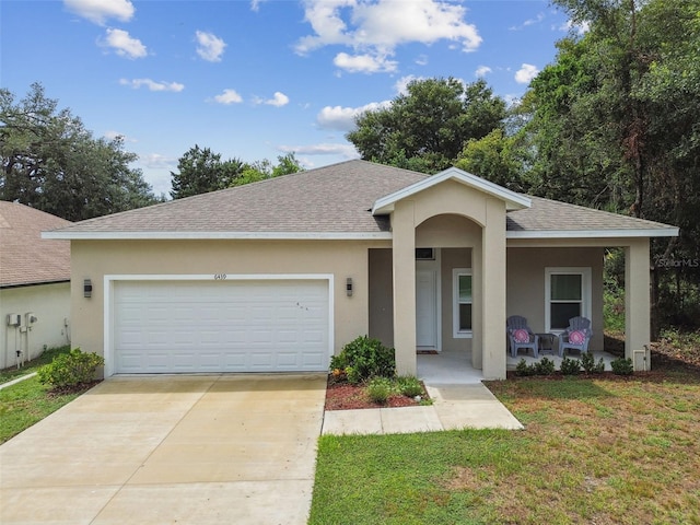 view of front of home with a garage, concrete driveway, a porch, and stucco siding