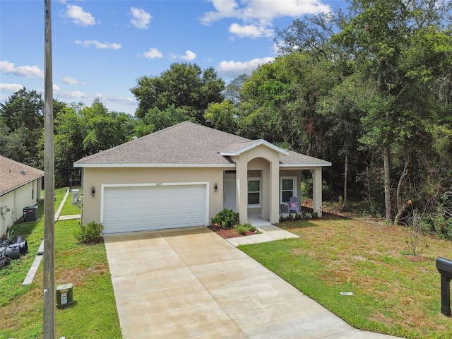 view of front of property featuring an attached garage, a front lawn, concrete driveway, and stucco siding