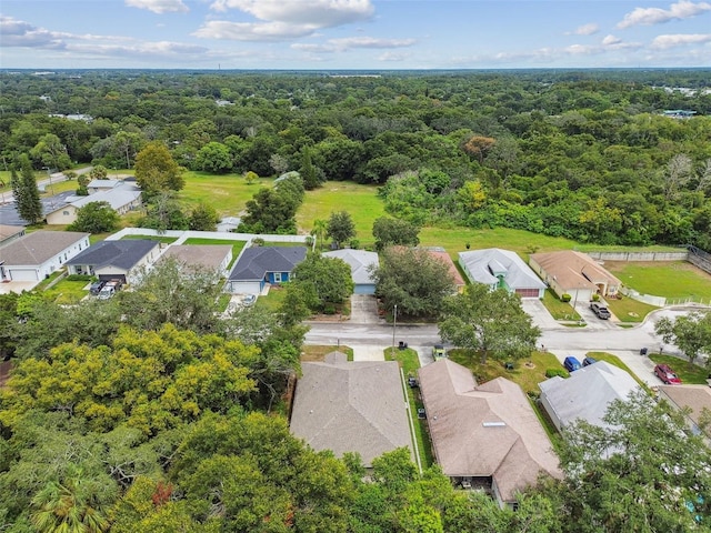 bird's eye view with a forest view and a residential view