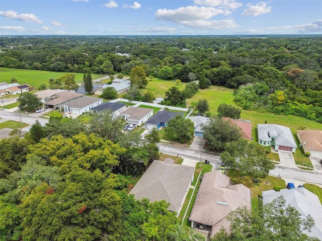 bird's eye view with a residential view and a wooded view