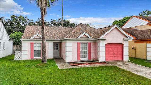 ranch-style home featuring stucco siding, a shingled roof, an attached garage, driveway, and a front lawn