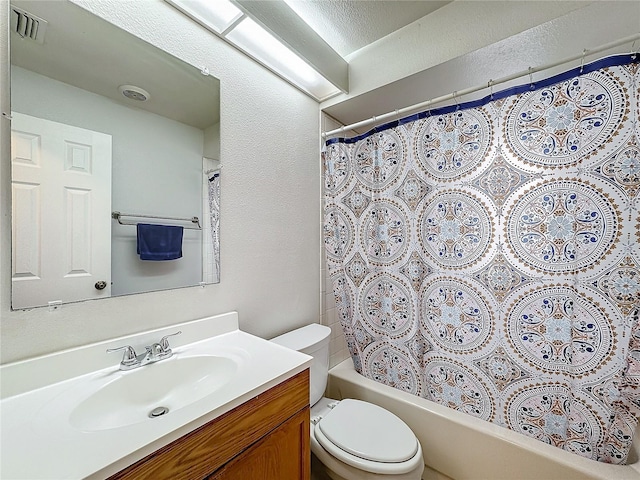 full bathroom with toilet, visible vents, shower / tub combo with curtain, and vanity