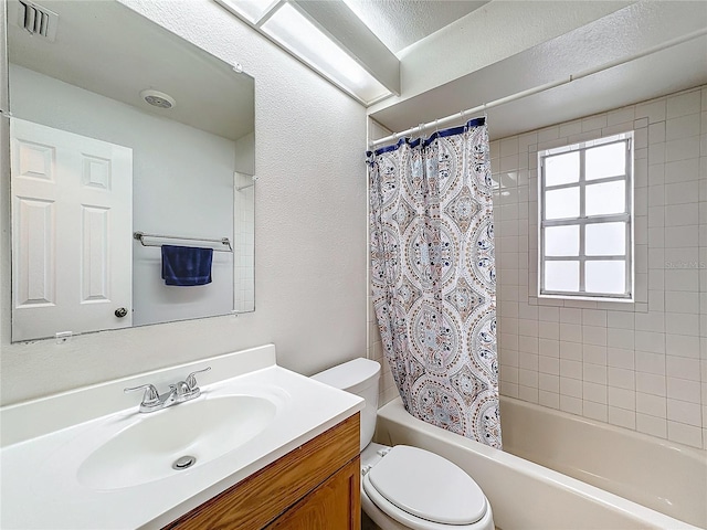 bathroom with toilet, shower / bathtub combination with curtain, visible vents, and vanity