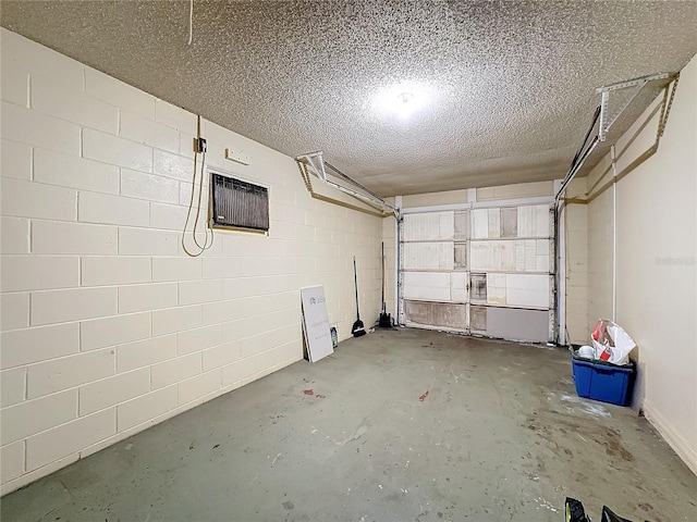 garage with concrete block wall