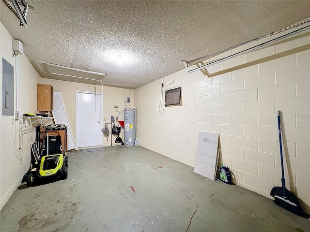 garage with concrete block wall, electric panel, and electric water heater