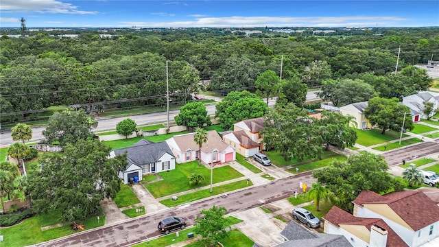 bird's eye view featuring a residential view and a view of trees