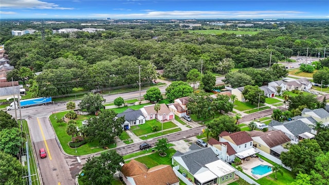 birds eye view of property with a forest view and a residential view