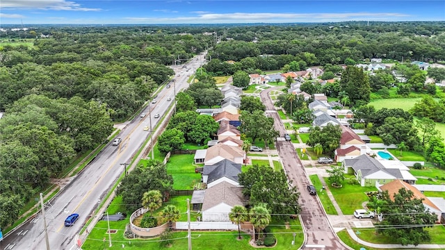 aerial view with a residential view and a wooded view