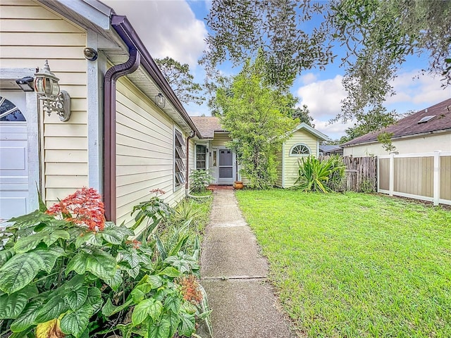 view of yard with a garage and fence