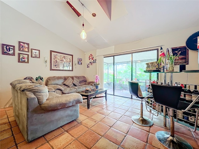 living room featuring vaulted ceiling and light tile patterned floors