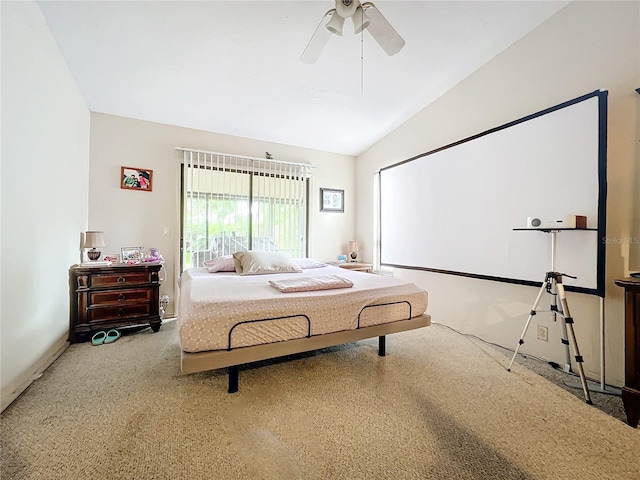 carpeted bedroom featuring lofted ceiling and ceiling fan