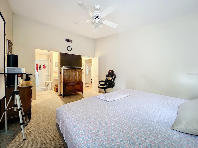 bedroom featuring light carpet, ceiling fan, and visible vents