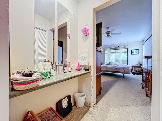 bathroom with ceiling fan and vanity