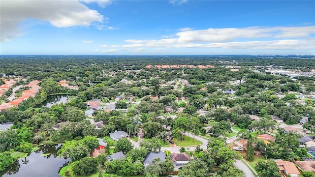 bird's eye view featuring a water view and a residential view