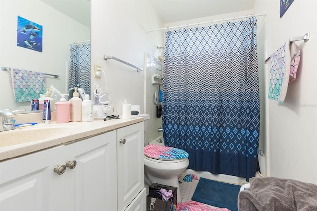 full bathroom featuring tile patterned flooring, shower / bath combination with curtain, vanity, and toilet