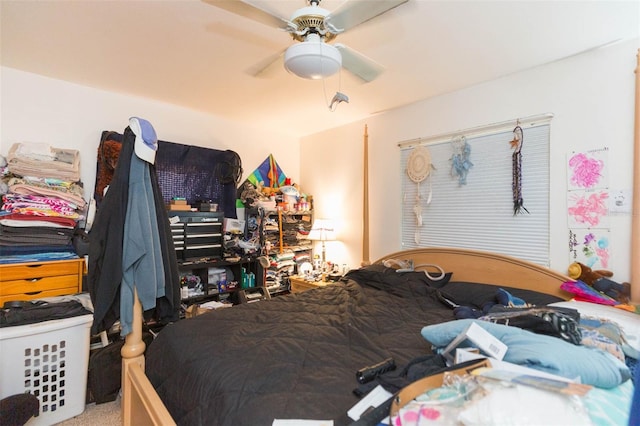 bedroom featuring ceiling fan and carpet