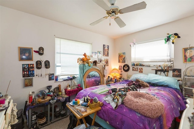 bedroom with ceiling fan and carpet flooring