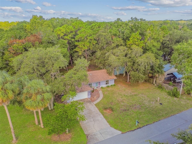 drone / aerial view featuring a view of trees