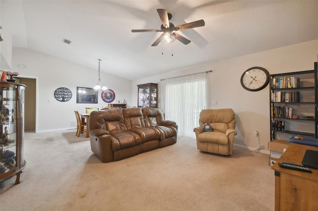 living room with ceiling fan, light colored carpet, and vaulted ceiling