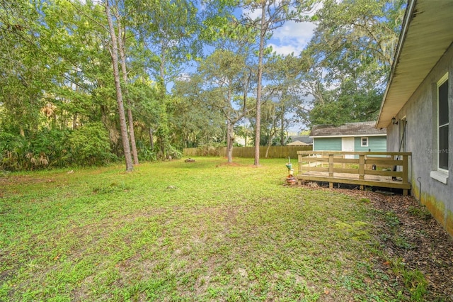 view of yard featuring a wooden deck